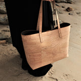 model with cork handbag on the beach